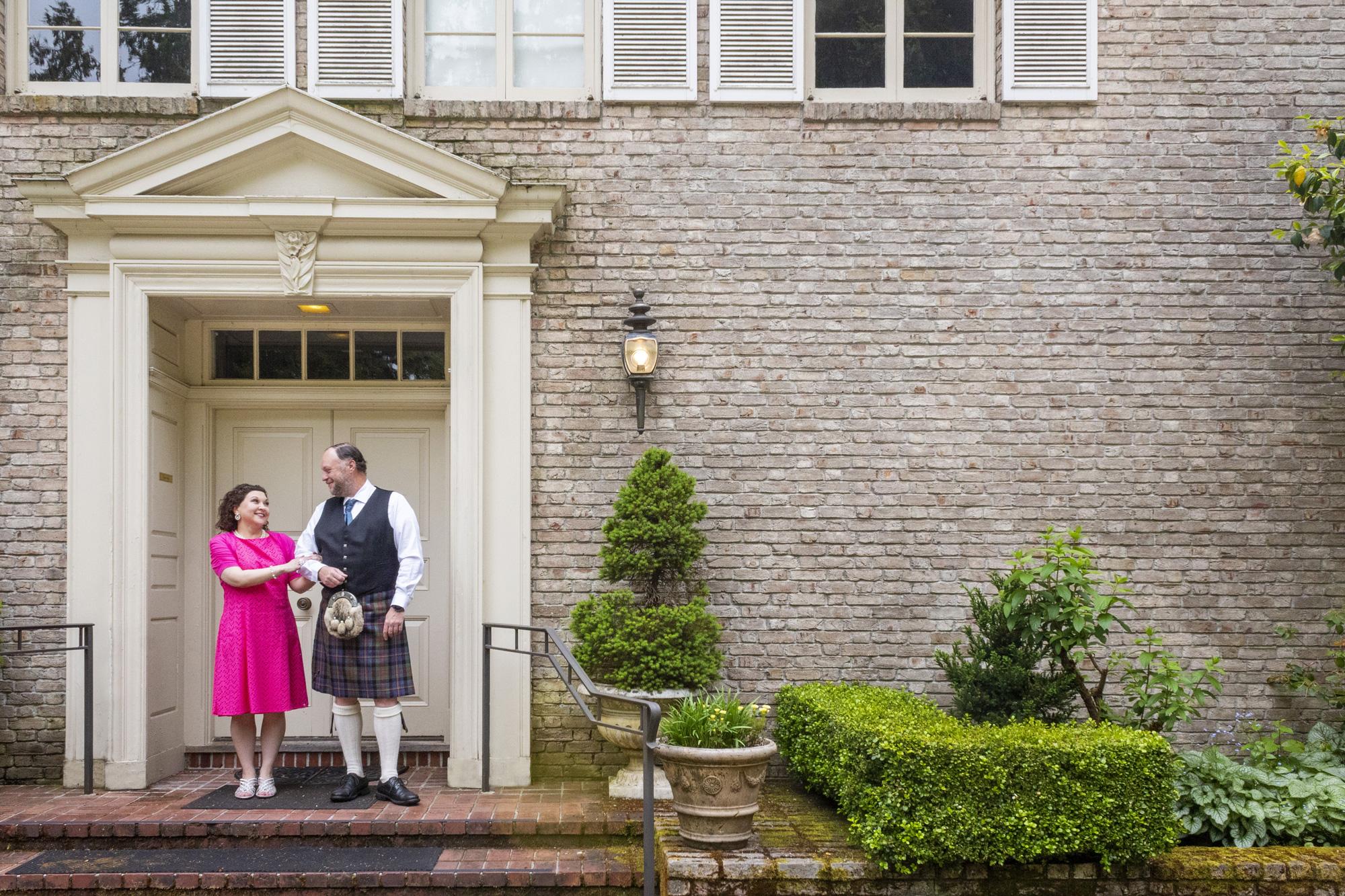 Man and woman standing in doorway at Lakewold Garden mansion